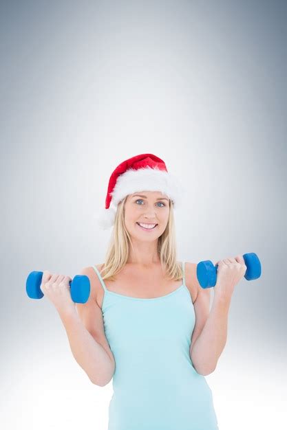 Premium Photo Festive Fit Blonde Holding Dumbbells