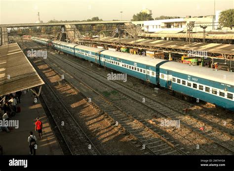 Railroad tracks, train, and morning view of New Delhi Railway Station ...