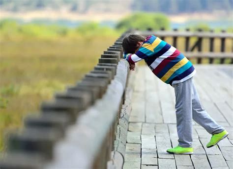 Sad boy standing alone Stock Photos, Royalty Free Sad boy standing ...