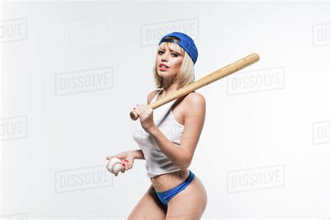 Portrait Of Sensual Woman With Baseball Bat And Ball Looking At Camera