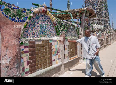 Tour guide at Watts Towers. Watts, Los Angeles, California, USA Stock Photo - Alamy