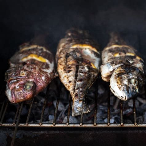 Grilled Fish With Spices On Fire Close Up Grilling Fish Dorado Stock