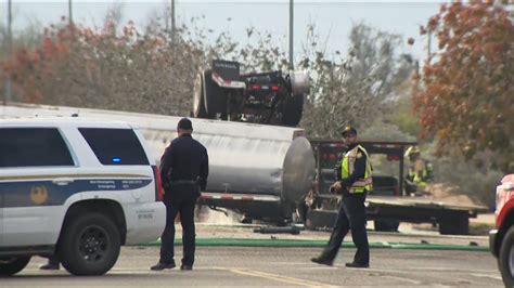 Gasoline Tanker Dumping Fuel In Roadway After Crash