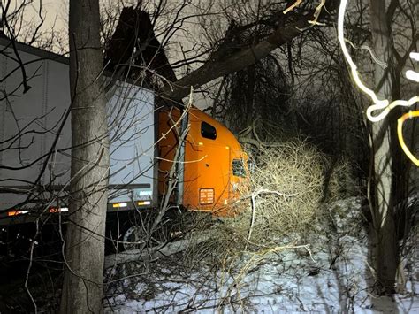 Minor Injuries Reported As Tractor Trailer Jumps Highway Barrier