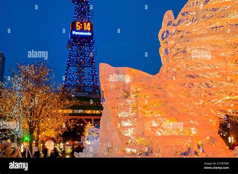 Ice sculptures illuminated at night at the Sapporo Snow Festival in ...