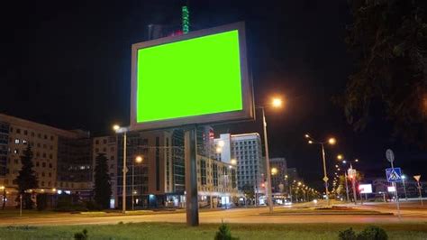 Time Lapse Of Blank Billboard With A Green Screen On A Background Of A