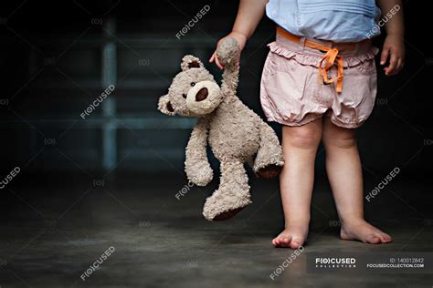 Girl Holding Teddy Bear Caucasian Front View Stock Photo