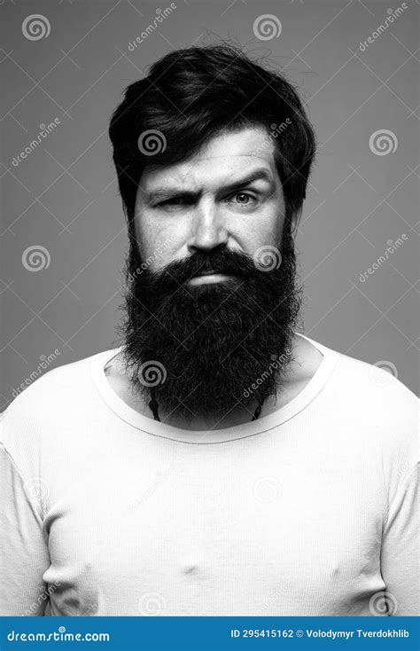 Portrait Of Confident Serious Man Has Beard And Mustache Looks Seriously Isolated Hipster Guy