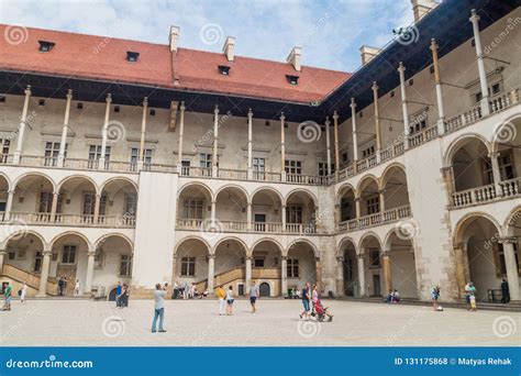 KRAKOW, POLAND - SEPTEMBER 3, 2016: Tourists Visit a Courtyard of the ...