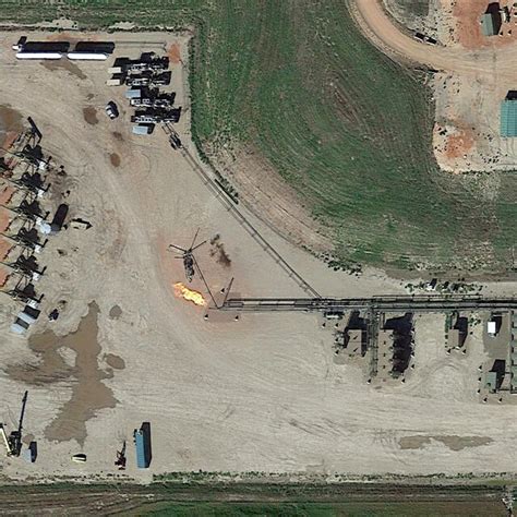 3: This Google Earth imagery shows gas flaring being conducted on a ...