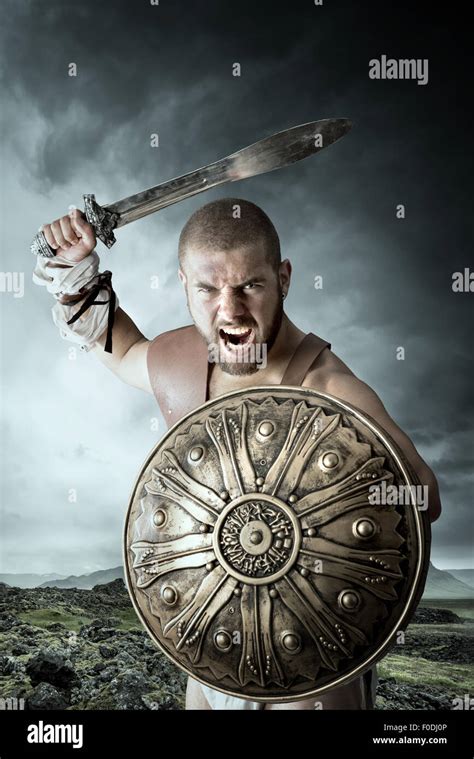 Gladiator warrior posing shield sword hi-res stock photography and ...