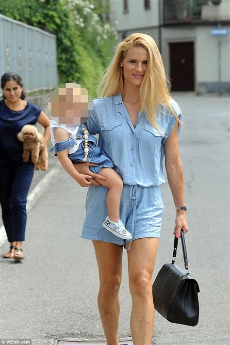 Michelle Hunziker Displays Her Long Legs In Denim Playsuit Daily Mail