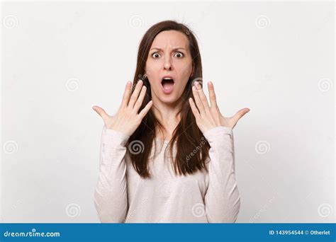 Shocked Young Woman In Light Clothes Keeping Mouth Wide Open And