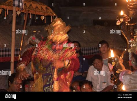 Dramatic photo of colorfully dressed Kecak dancers dressed in ...