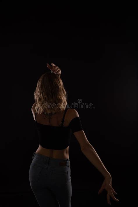 Silhouette Of The Back Of A Dancing Blonde Woman Stock Photo Image Of