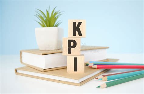 Kpi Key Performance Indicator Text On Wooden Cubes On Office Table For