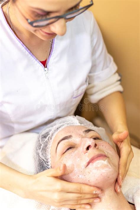 Beautician Make A Facial Treatment In The Spa Center Stock Image