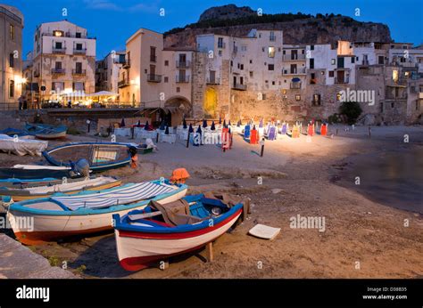 Small Fishing Boats On The Beach At Night Cefalu Sicily Italy Stock