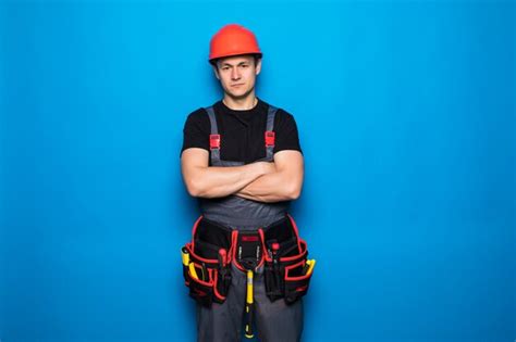 Premium Photo Portrait Of Happy Handyman With Tools Belt