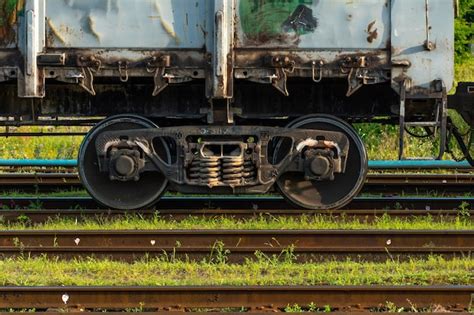 Premium Photo | Details of the train in closeup railway locomotive wheels and springs repair train