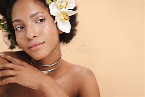 Portrait Of Half Naked African American Woman With Flowers In Her Hair