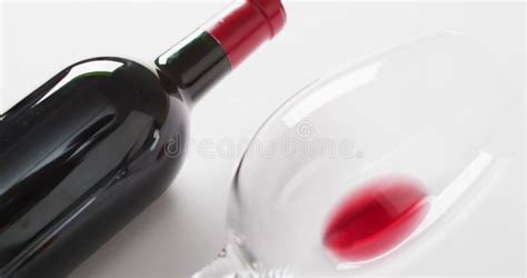 Red Wine Bottle Empty Glass Cork And Corkscrew Lying On White Surface