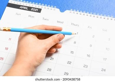 Woman Marking Date Calendar On Color Stock Photo 2093438758 Shutterstock