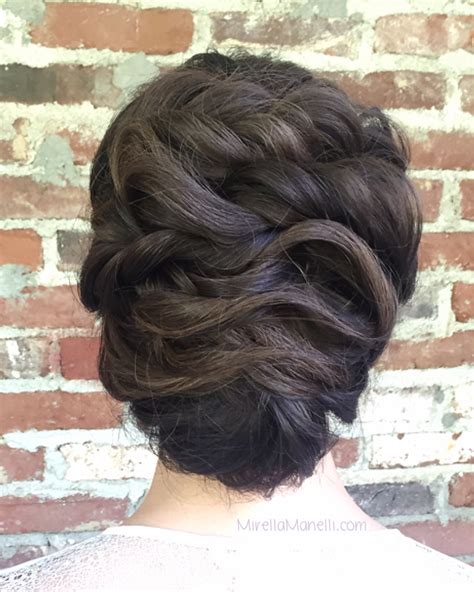 Brides are debating the messy updo versus classic styles online today 14