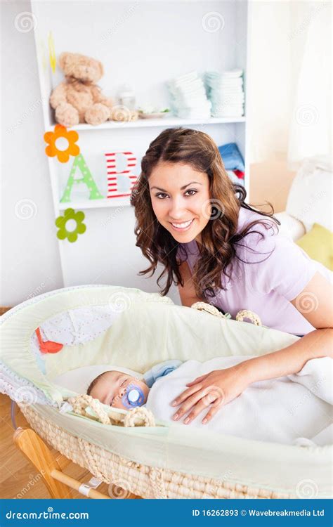 Attentive Young Mother Taking Care Of Her Baby Stock Image - Image ...