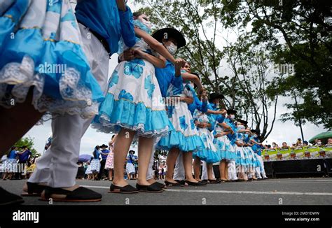 Folk dancers parade during the International Tournament of Joropo in ...