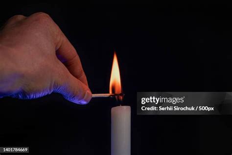 Black Hand Holding Candle Photos And Premium High Res Pictures Getty