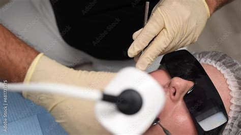 Doctor Scans The Patient S Teeth In The Clinic The Dentist Holds In