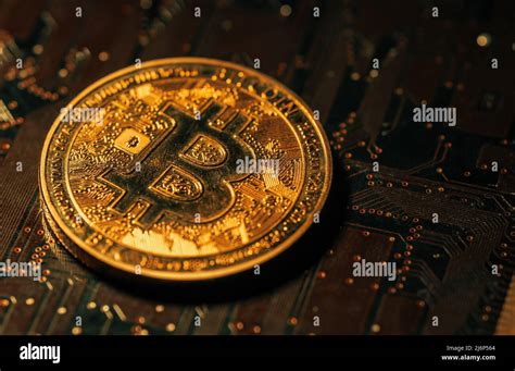 Physical Version Of Golden Bitcoin On Microchip Stock Photo Alamy