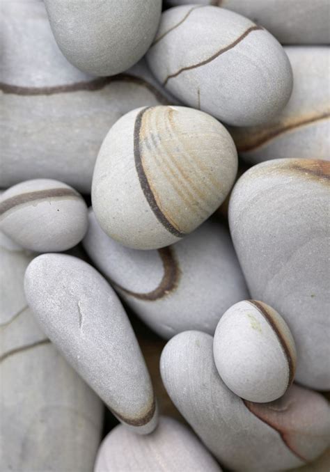 Several White And Brown Rocks Stacked On Top Of Each Other