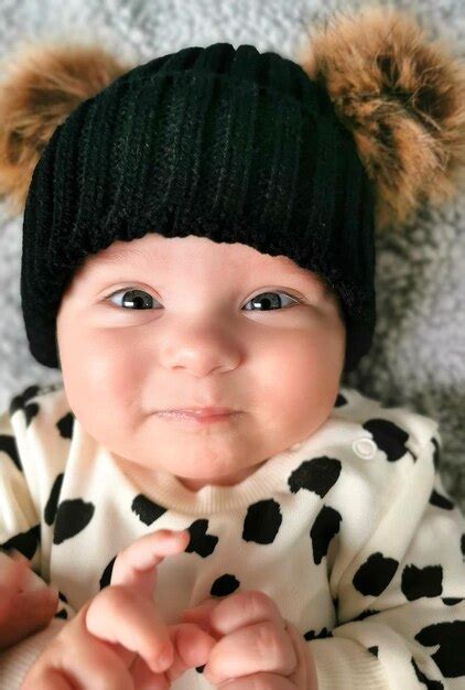 Premium Photo Portrait Of Cute Baby Lying On Bed