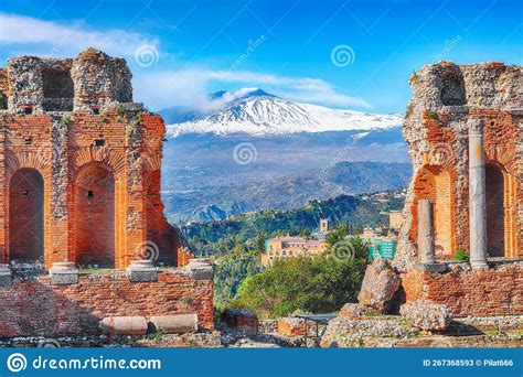 Ruins Of Ancient Greek Theater In Taormina And Etna Volcano In The