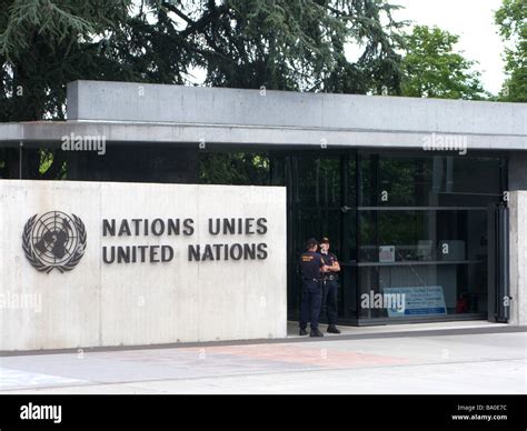 Two Officers Stand Guard At The Entrance To The United Nations In