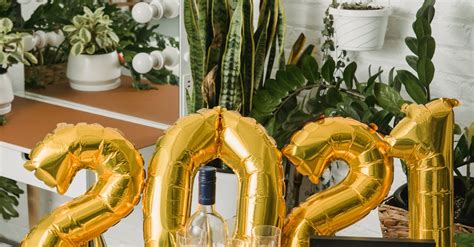 Gold Letter Balloons on the Table · Free Stock Photo