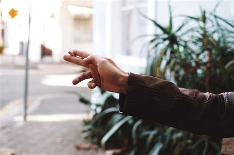 Premium Photo Cropped Hand Holding Cigarette