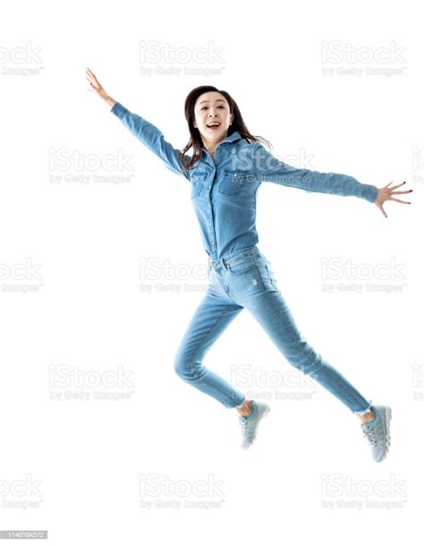 Excited Woman Jumping On White Background Stock Photo Download Image