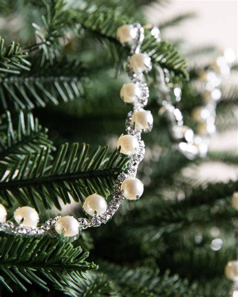 Hanging Bead Garland On A Christmas Tree