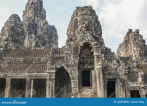 Stone Faces On Facade At Bayon Temple In Angkor Tom Siem Reap