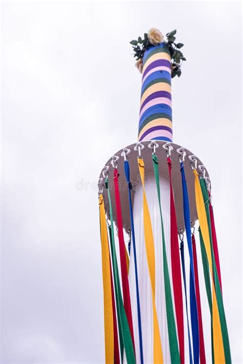 Coloured Ribbons Hanging From A Traditional English Maypole On May Day