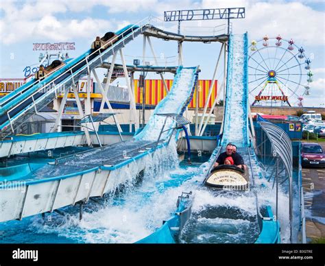 Family having fun on the Log flume at Skegness seafront fairground amusement park Lincolnshire ...