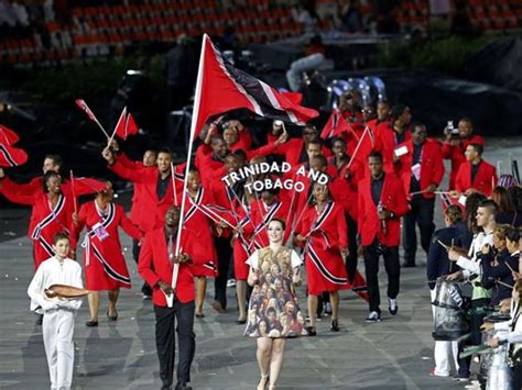 Trinidad And Tobagos Flag Bearer Marc Burns Holds The National Flag As