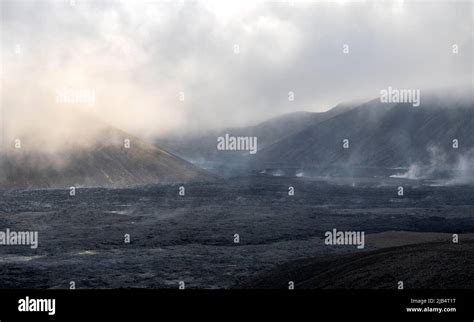 Steaming Lava Fields Between Hills Volcanic Eruption Active Table