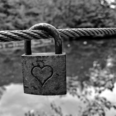 Premium Photo Close Up Of Heart Shape On Padlock Hanging On Rope