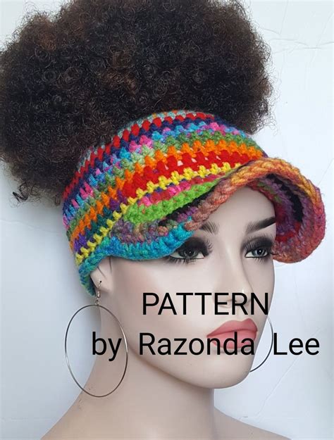 A Mannequin Head Wearing A Multicolored Crochet Hat