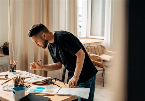 Premium Photo Portrait Of Concentrated Male Artist Standing Near A