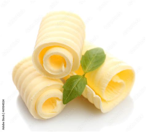 Curls of fresh butter with basil, isolated on white Stock Photo | Adobe Stock